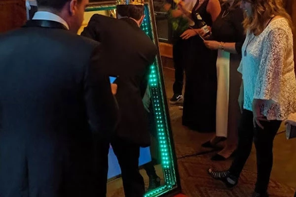 Wedding guests using selfie mirror